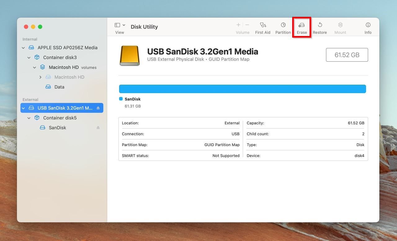 Disk Utility on macOS showing an external USB drive selected (USB SanDisk 3.2Gen1 Media) with the "Erase" button highlighted.