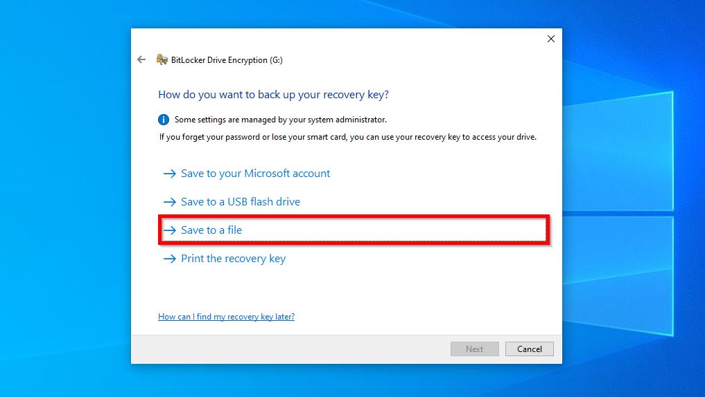 BitLocker Drive Encryption dialog in Windows asking how to back up the recovery key, with the "Save to a file" option highlighted.