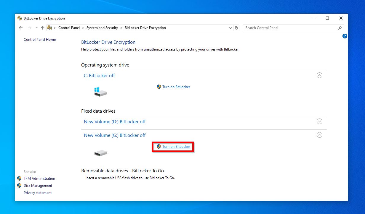 BitLocker Drive Encryption settings in Windows Control Panel showing drives with BitLocker off and the "Turn on BitLocker" option highlighted for New Volume (G:).