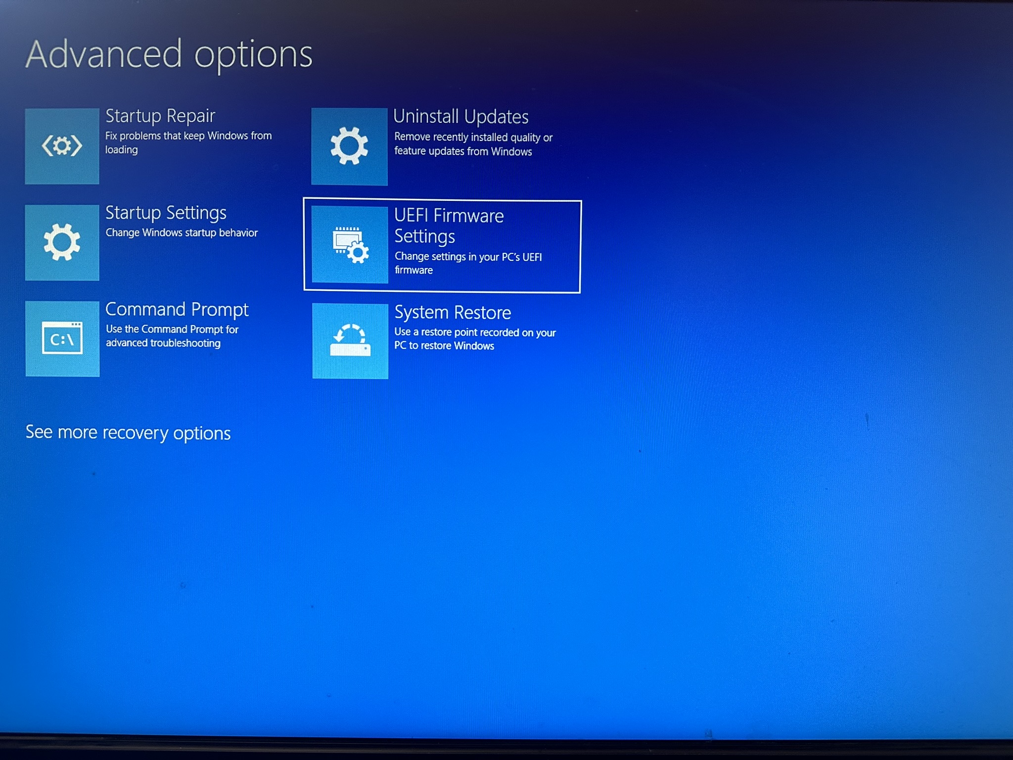 Windows Advanced Options menu showing various recovery options.